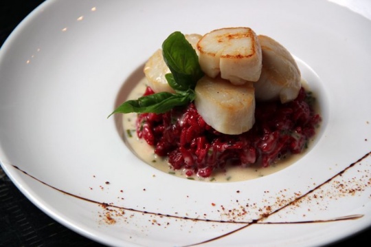 Beet juice and lemon zest risotto, caramelized scallops, chive beurre blanc butter sauce