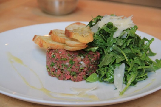 Beef tartare, roasted pine nuts, Parmigiano Reggiano crostini |